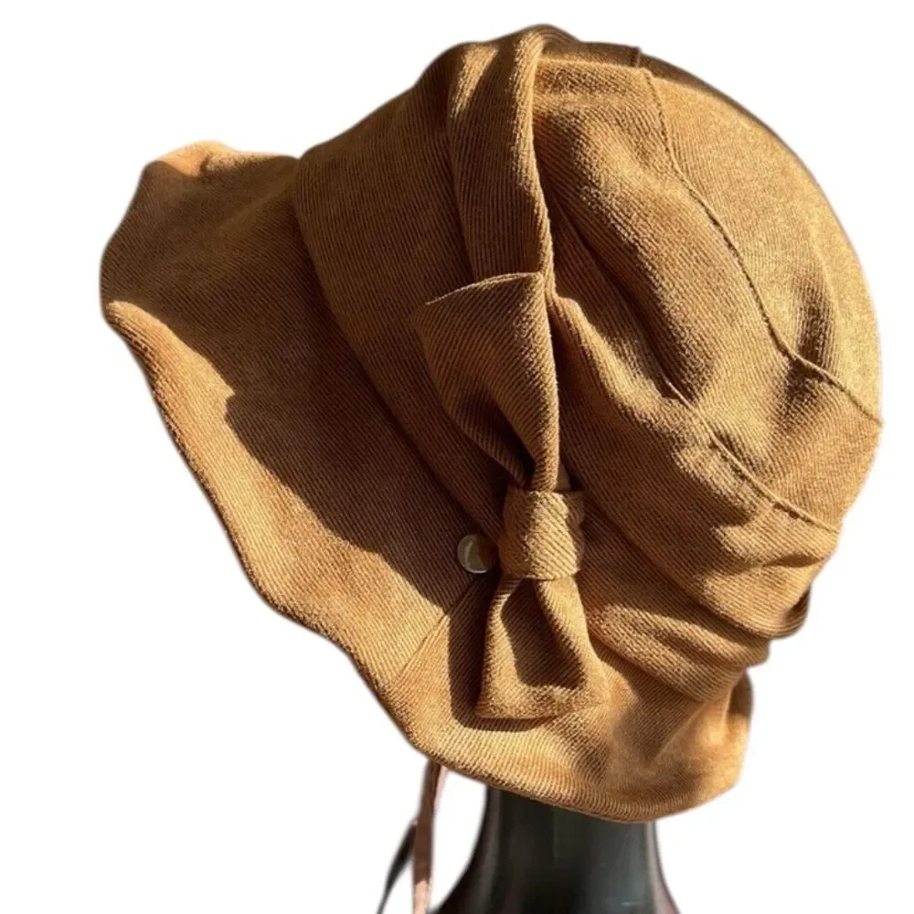 Comhats vintage caramel cloche bucket hat with a chin strap and drawstring